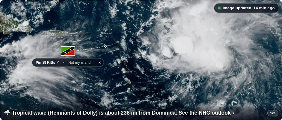 The dewedda.com homepage satellite image with Saint Kitts and Nevis marked by its flag and a prompt reading Pin St Kitts or Pick my island